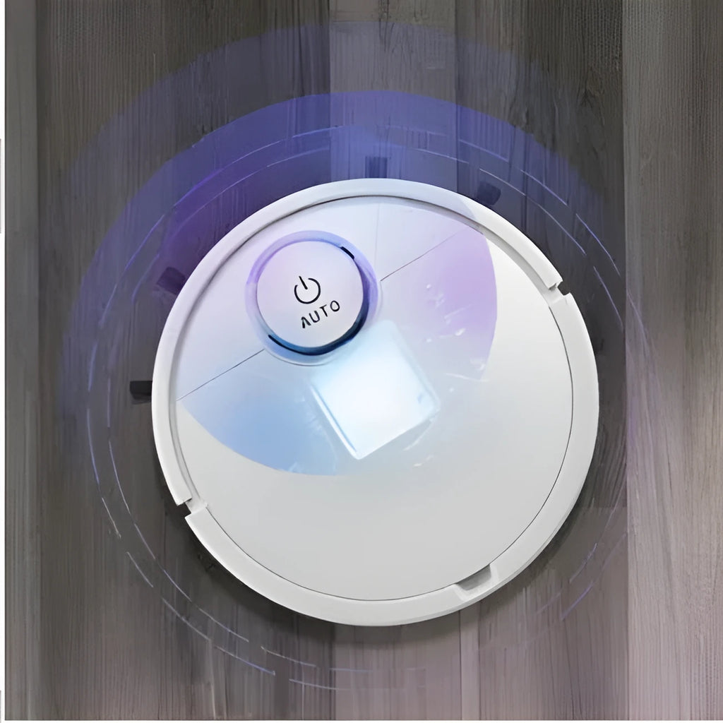 Automatic sweeping robot cleaner on a wooden floor, showing its square design and low profile.