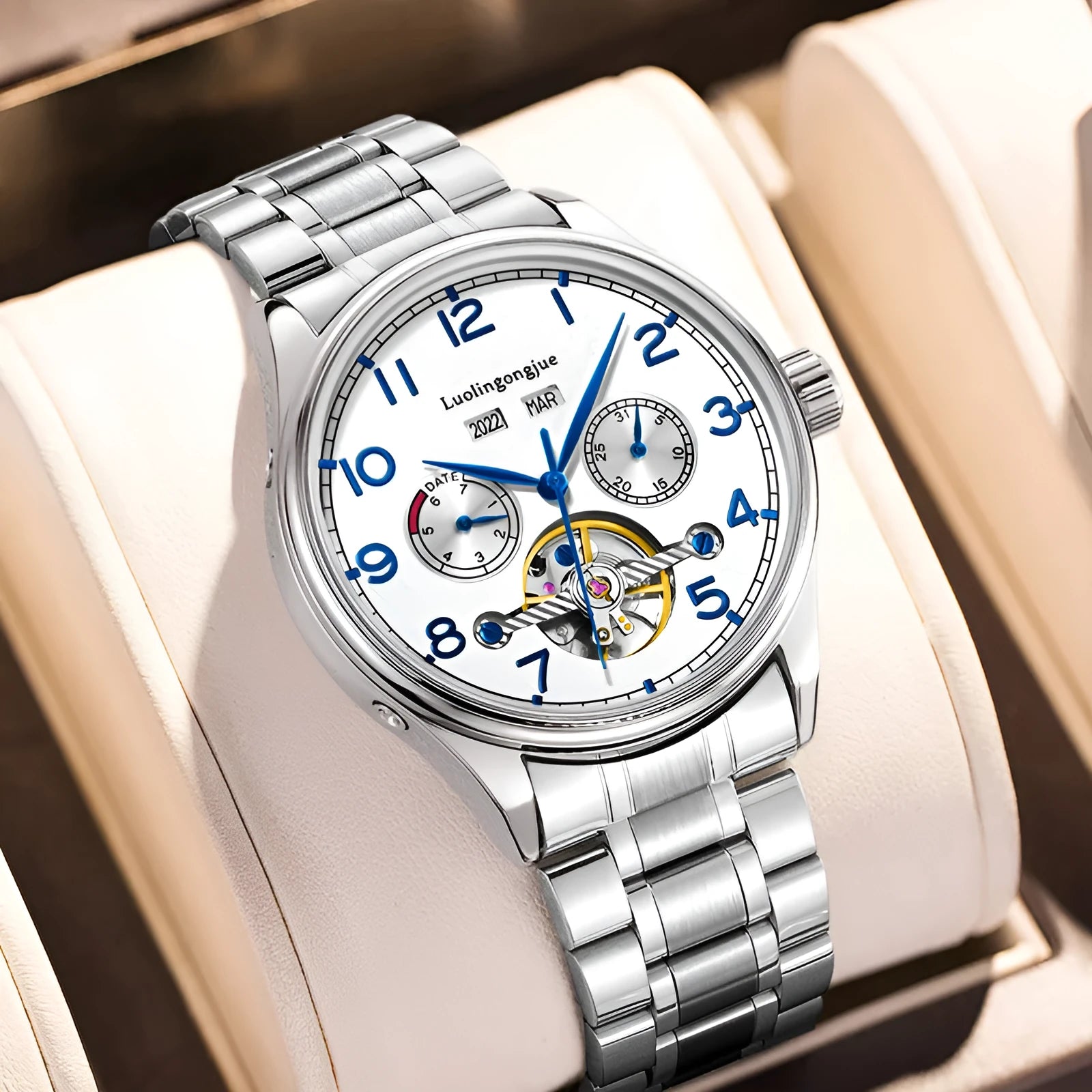 Men's stainless steel mechanical watch with hollow dial and leather strap.