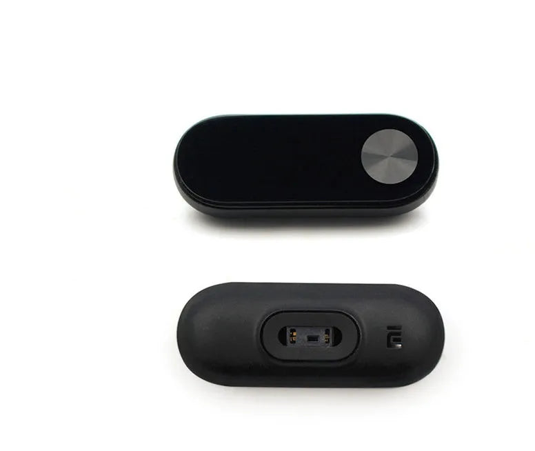 Black Xiaomi Mi Band 2 fitness tracker on wrist showing OLED display with heart rate reading