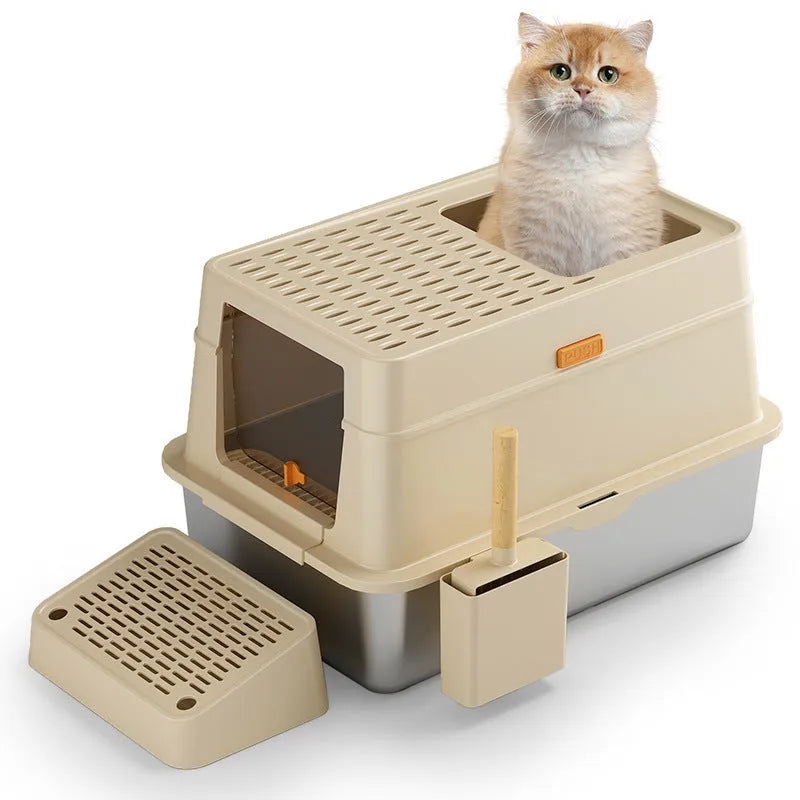 Grey enclosed cat litter box with a foot pedal and stainless steel pan inside
