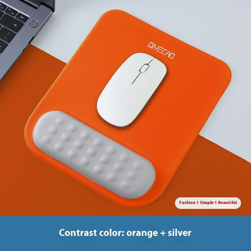 Ergonomic mouse pad with raised wrist support in a choice of contrast colour patterns on a desk.