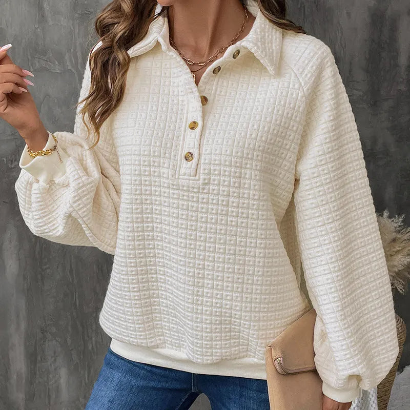 Beige women's polo collar sweater with long sleeves and a textured knit fabric.