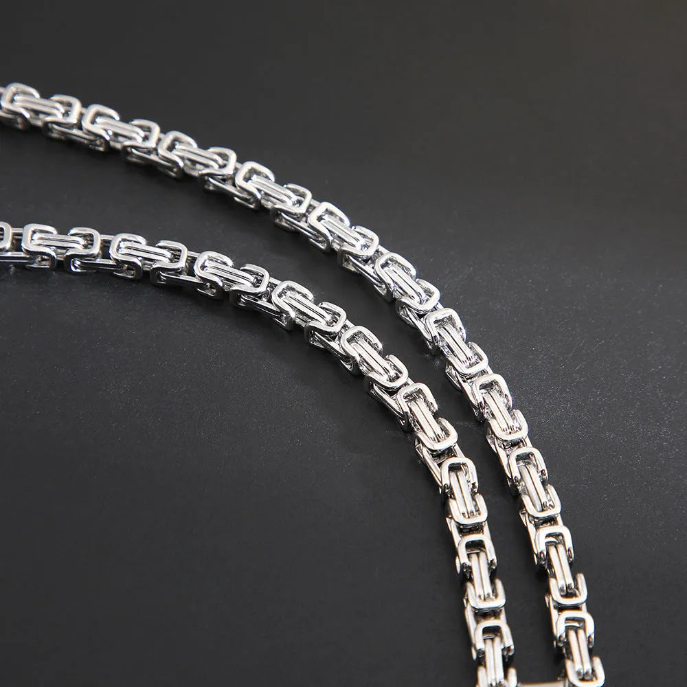 Men's titanium steel necklace with geometric water ripple pendant on an emperor chain.