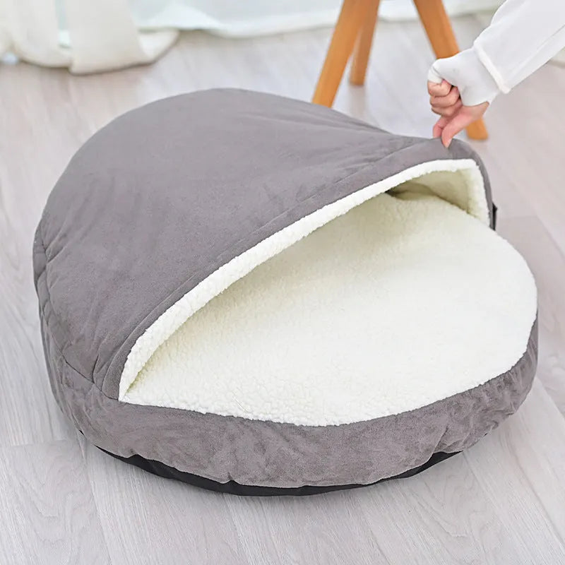 Brown cloth dog kennel with a removable cover for washing, shown in a home setting.
