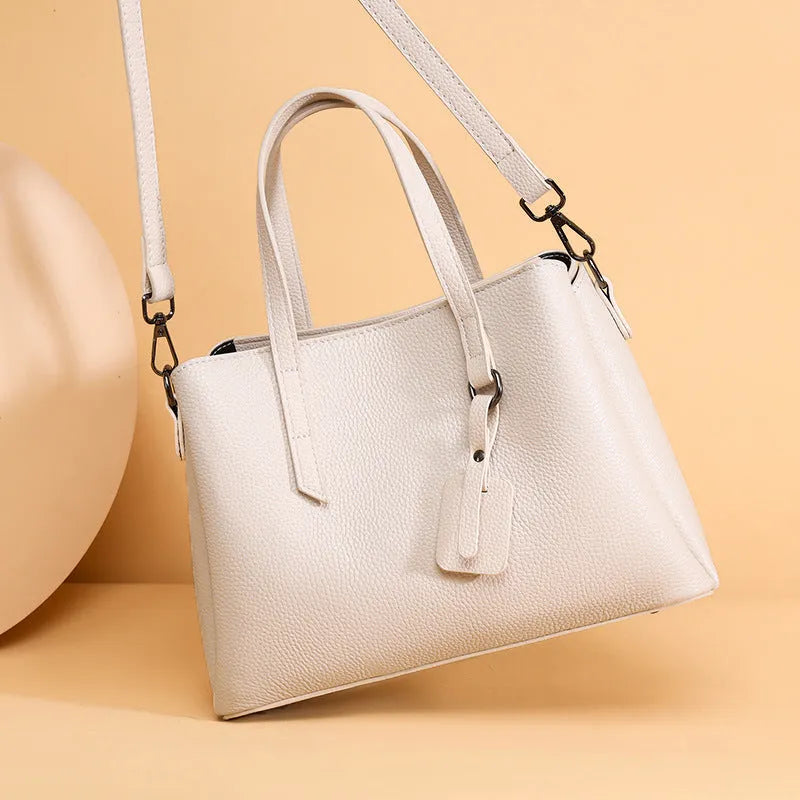 Women's cowhide leather shoulder handbag in horizontal square shape with contrast stitching