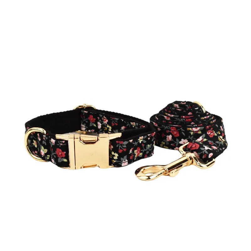 Four-piece pet accessory set showing dog collar, matching leash, decorative bow, and dog vest with cute printed lettering