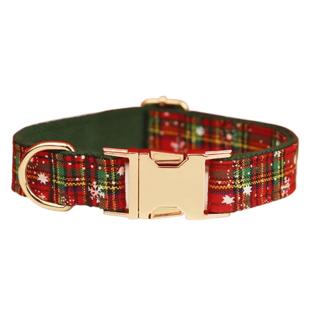 Green fabric Christmas pet collar and leash set with snowflake pattern, including a vest and decorative bow.