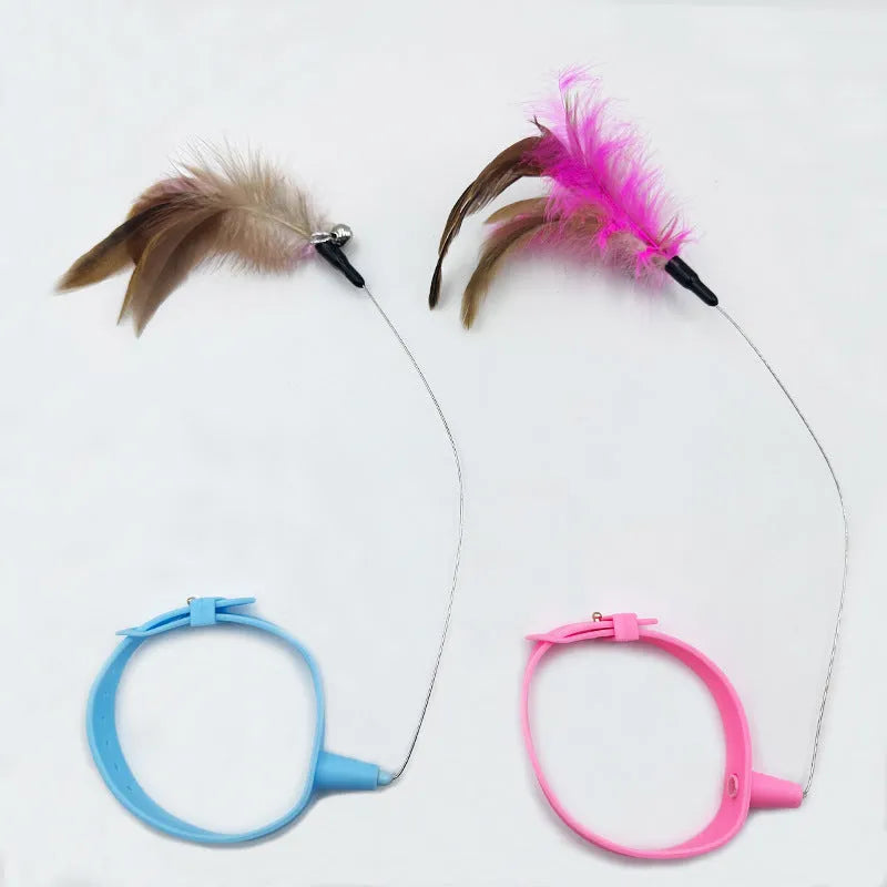 Adjustable cat collar toy with elastic feather teaser in pink or blue colour options