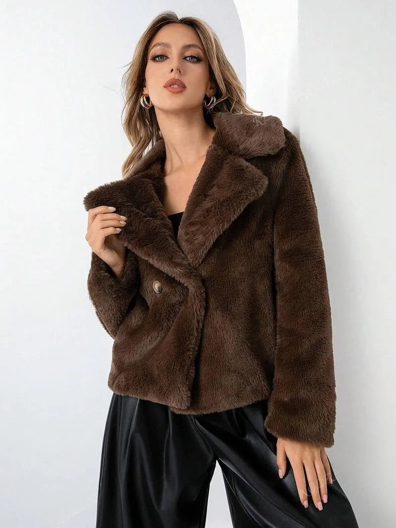 Women's short loose-fit faux fur coat in rose red on a hanger, showing regular sleeves and plush texture.