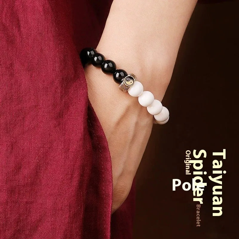 Black and white obsidian Tai Chi mantra bracelet with geometric woven beads
