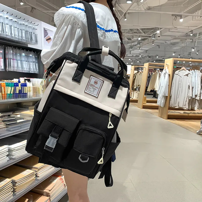Multi-functional large capacity nylon backpack for high school, breathable with curved shoulder strap and six colour options including black and pink