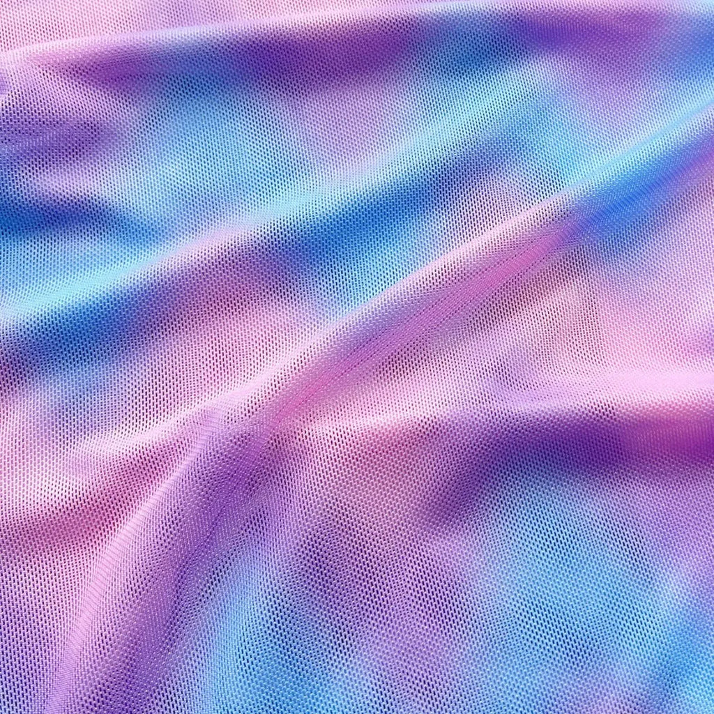 Women's tie-dye patterned bikini swimsuit set with bra, panties, and skirt.