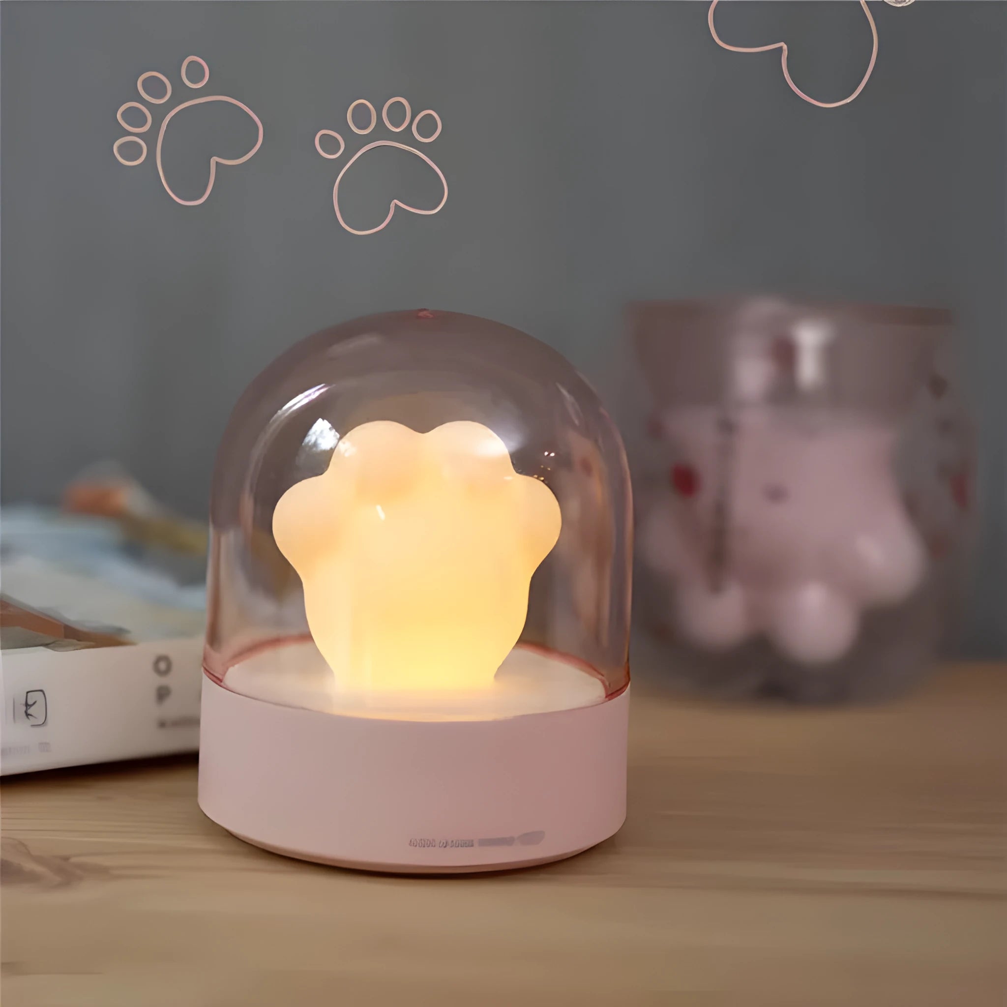 Grey and pink cat paw shaped night light with USB charging port and music box functions