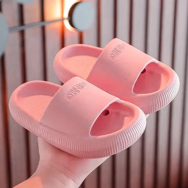 Children's bright coloured EVA slippers with a thick non-slip sole on a white background.