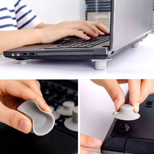 Grey plastic laptop cooling pad set showing two large and two small non-slip pads on a desk.