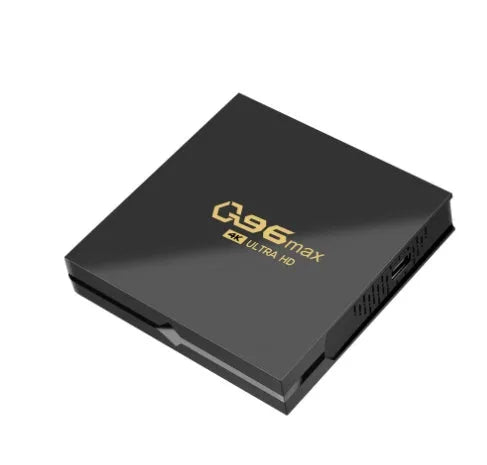 Q96 MAX S905 Android 4K TV Box set-top unit with remote control on a table.