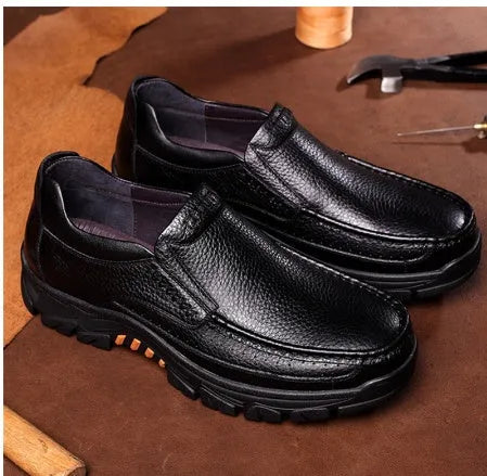Men's black and brown business casual slip-on shoes made from cowhide leather with rubber soles