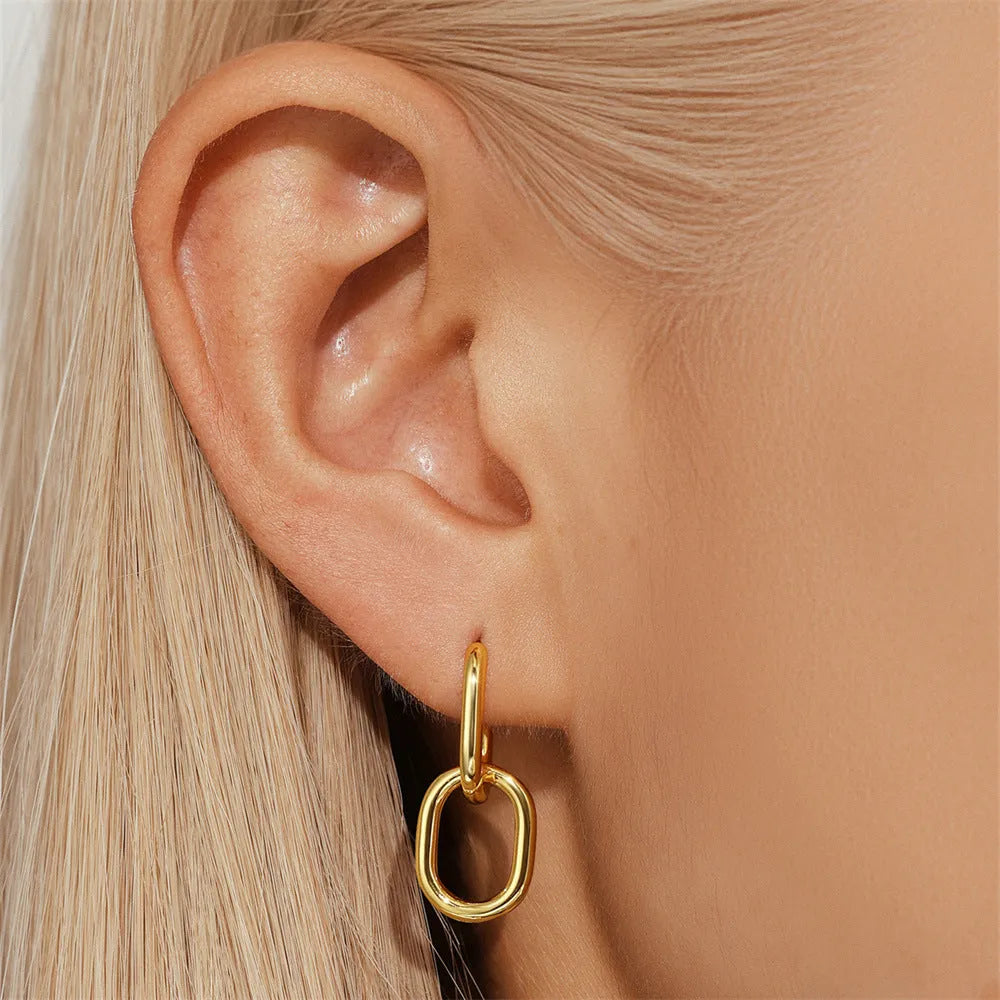 Golden brass earclip earrings with geometric round design and electroplated finish