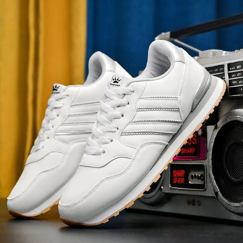 Men's black casual running shoes with a white carved wing pattern on the leather upper.