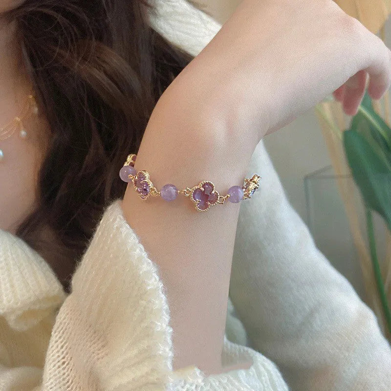 Women's U-shaped artificial amethyst bracelet with pearl and four-leaf clover charm on wrist