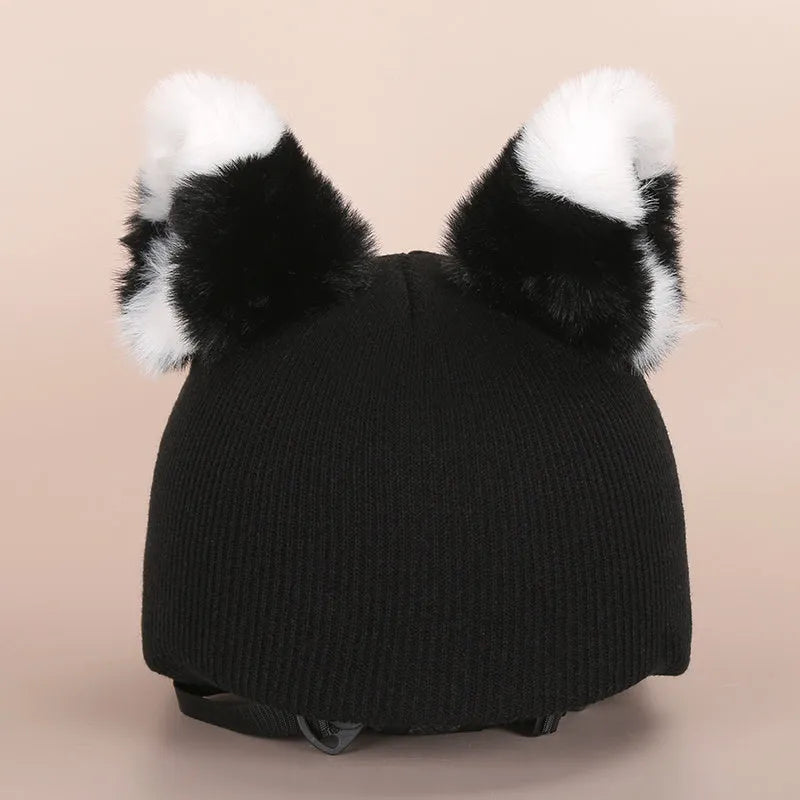Plush cartoon-themed cover set on a medium motorcycle helmet with soft ear decorations.