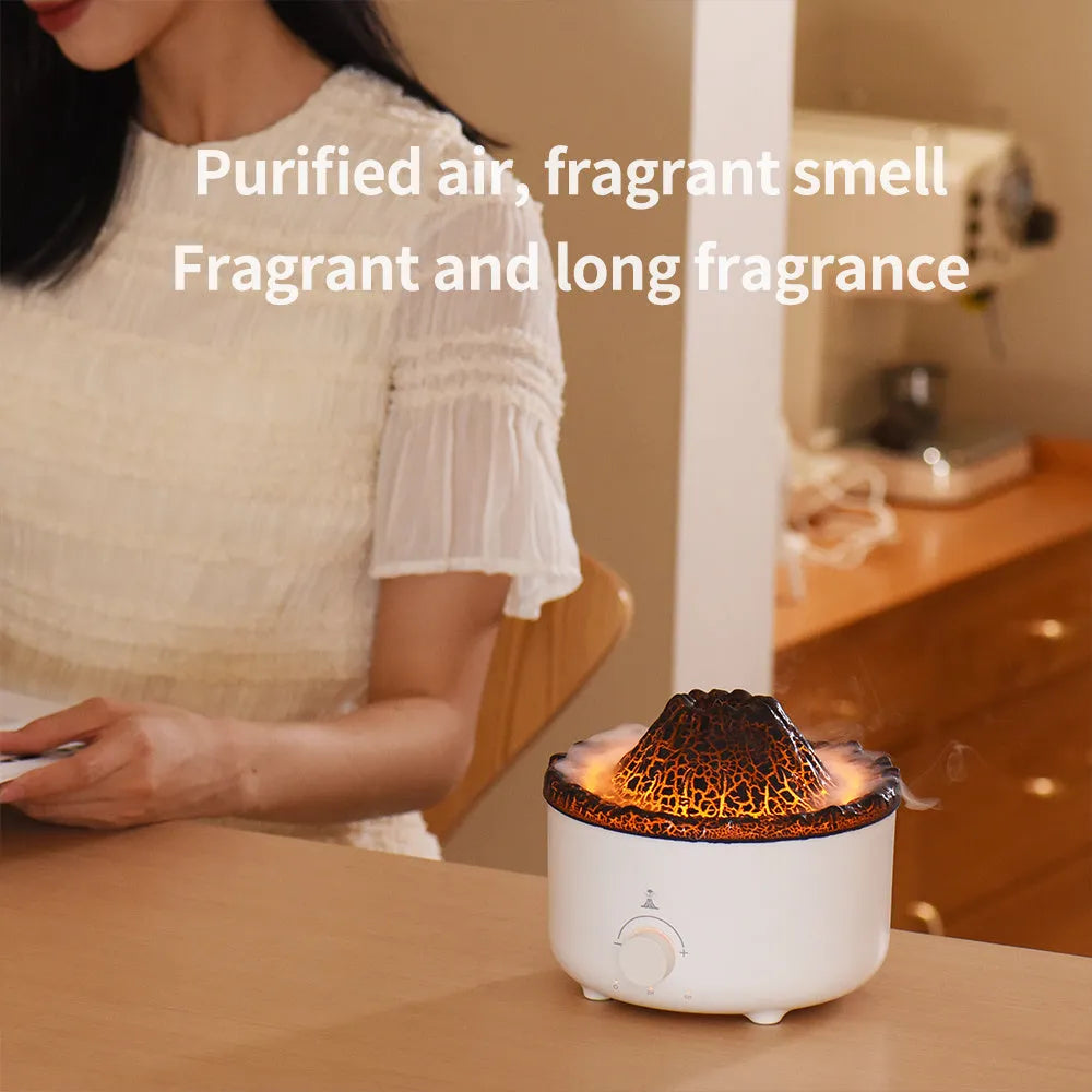Small white volcano-shaped humidifier with simulated flame lighting and remote control on wooden table
