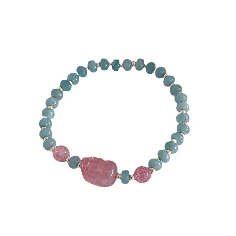 Natural blue water jade bracelet with gourd charm and peace buckle on woman's wrist