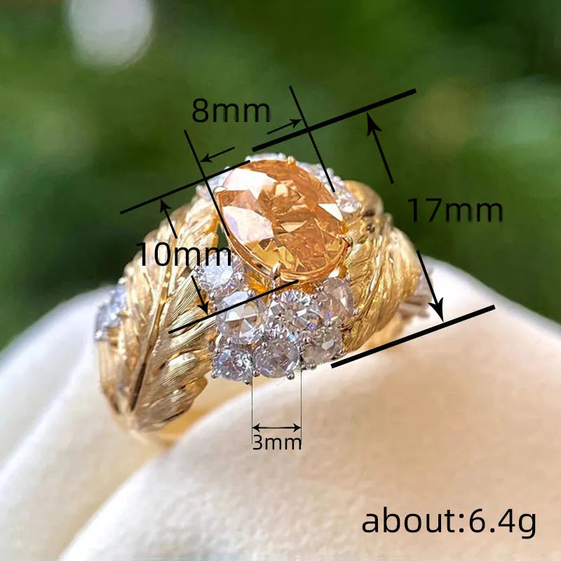 Women's gold copper ring with embossed feather pattern and yellow zircon stones