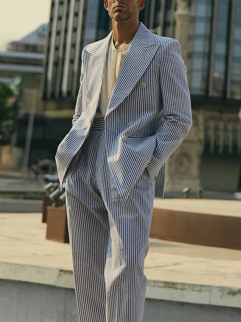 Blue and white striped polyester suit set with blazer and trousers on mannequin