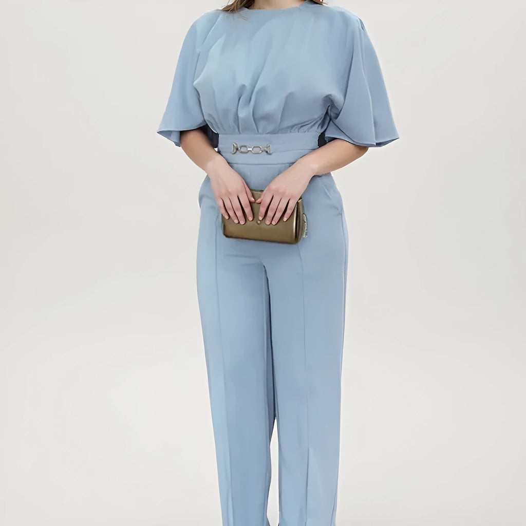 Men's blue two-piece casual suit with long-sleeved jacket and trousers on a hanger.