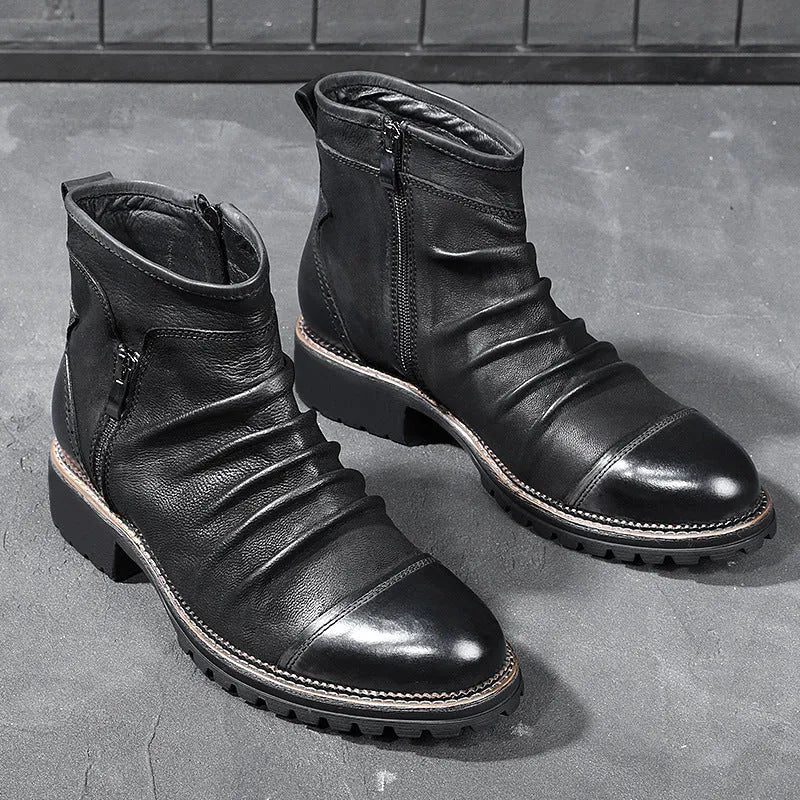 Mid-calf black cowboy boot with side zipper, embossed pattern, round toe, and a mid-height heel.