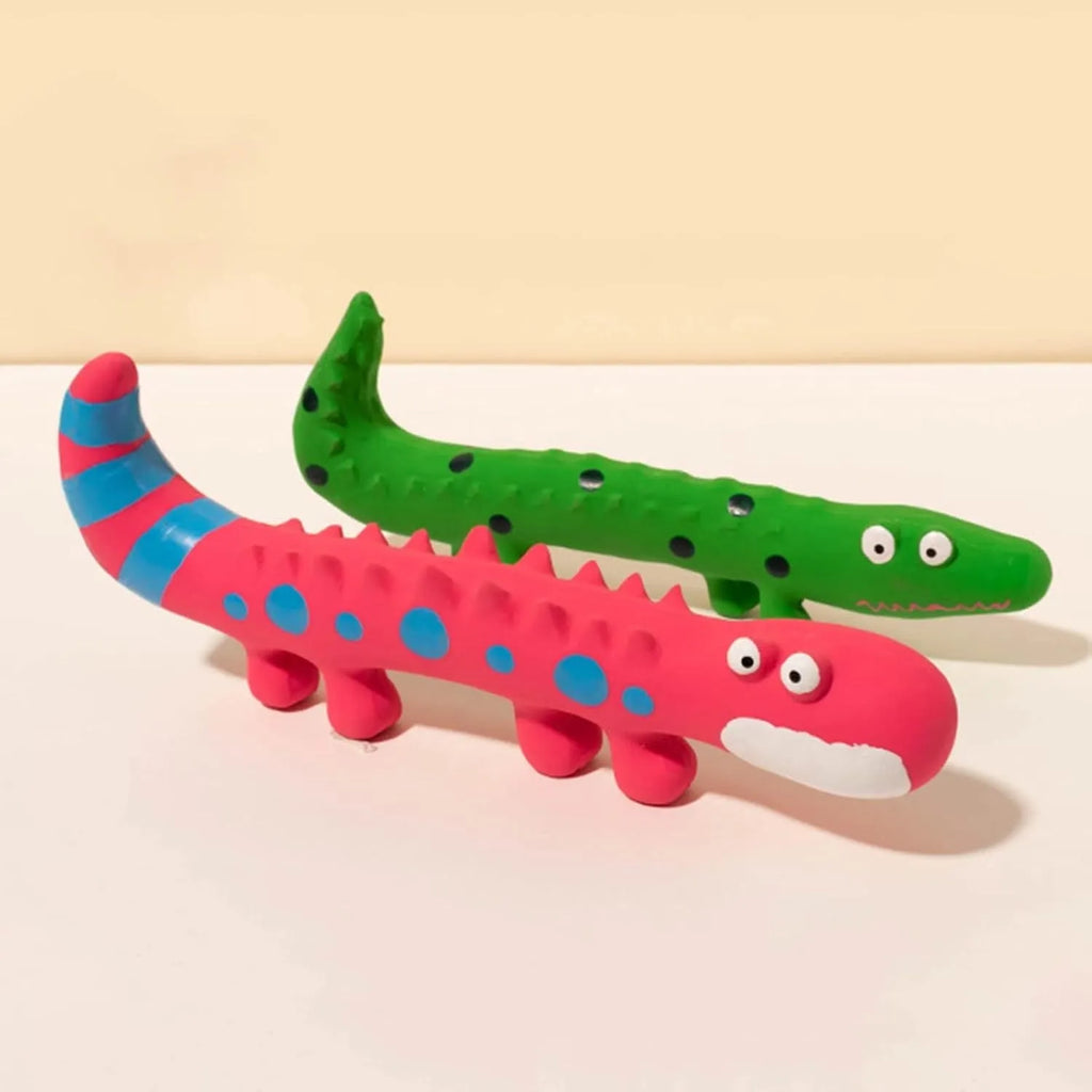 Green lizard-shaped latex dog chew toy with squeaker on a white background