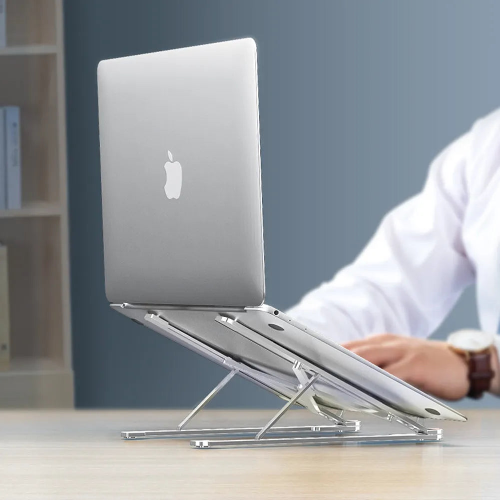Silver aluminium laptop stand holding a MacBook, shown in both open and folded flat positions.