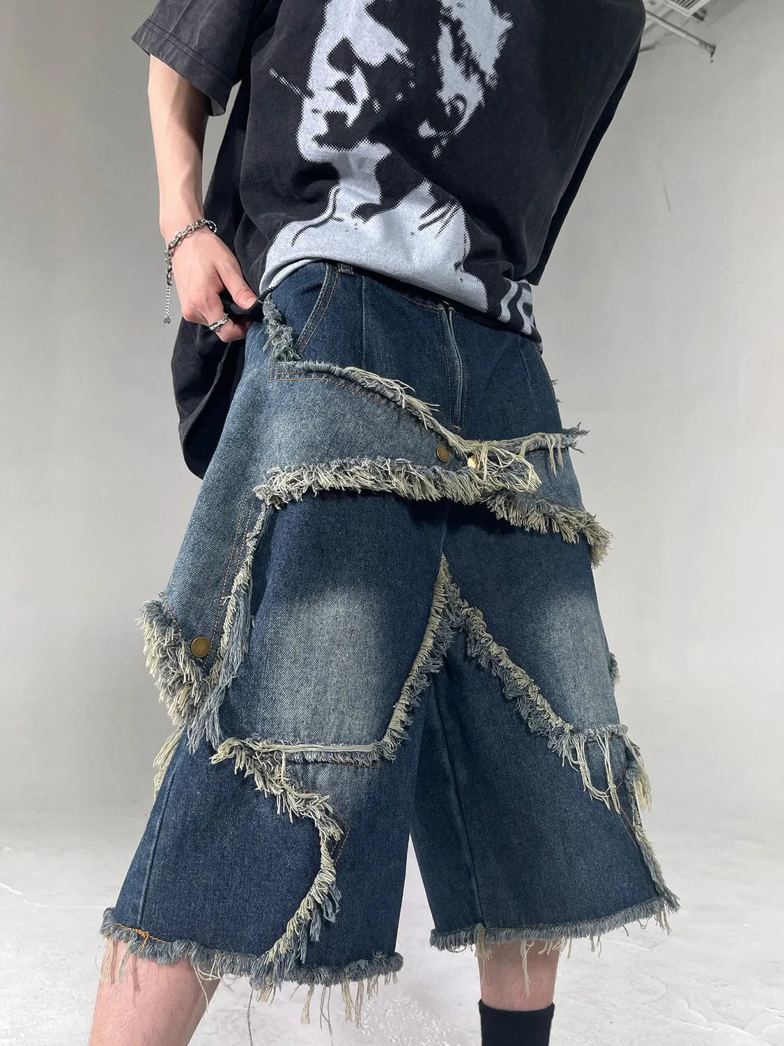 Blue retro denim shorts with frayed five-pointed star decoration and loose fit