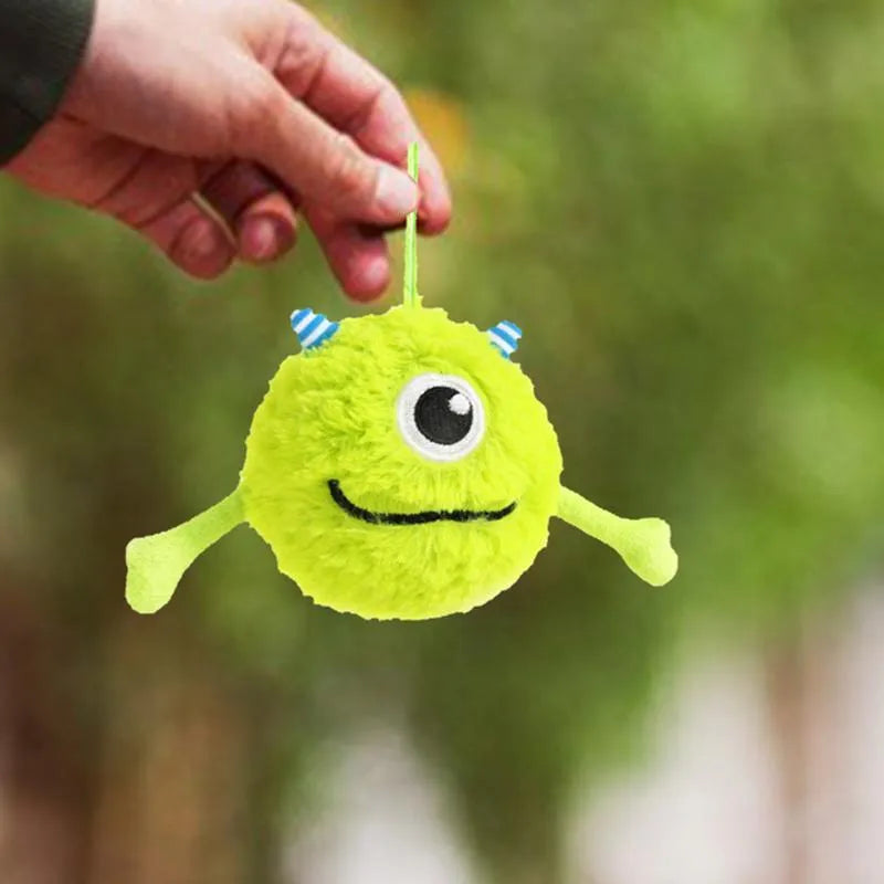 Green interactive sound dog teething ball toy made of plush and TPR, approximately 12cm in diameter.