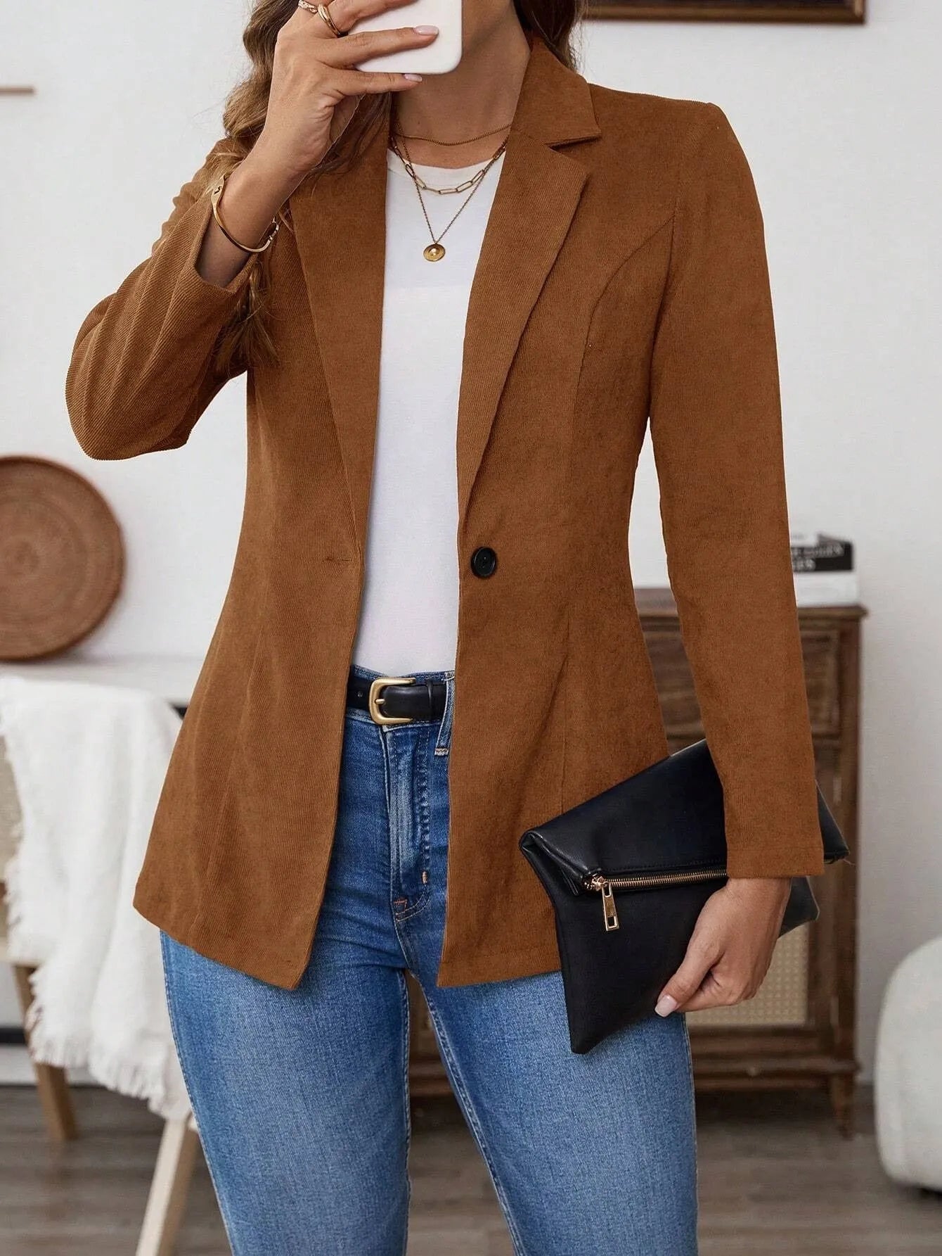 Brown single-breasted men's leisure suit coat with lapel collar and long sleeves.