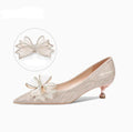 Champagne coloured pointed toe stiletto pumps with sequin detailing and rubber sole