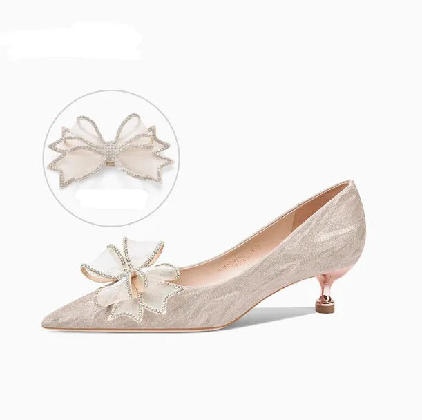 Champagne coloured pointed toe stiletto pumps with sequin detailing and rubber sole