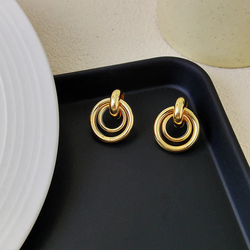 Geometric round ring earrings with irregular design in gold or silver electroplated finish