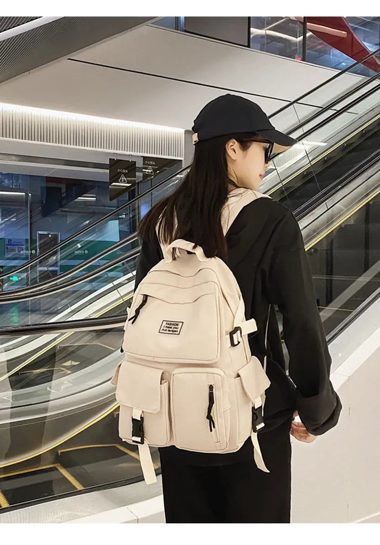 Nylon student backpack in black colour showing laptop compartment and three-dimensional pockets
