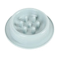 Blue pet slow feeder bowl with raised obstacles on a kitchen floor.