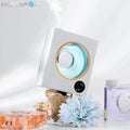 Small white wall mounted automatic aromatherapy machine with USB charging port.