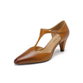 Brown women's retro sandals with a buckle T-strap, closed round toe, and a chunky short heel.