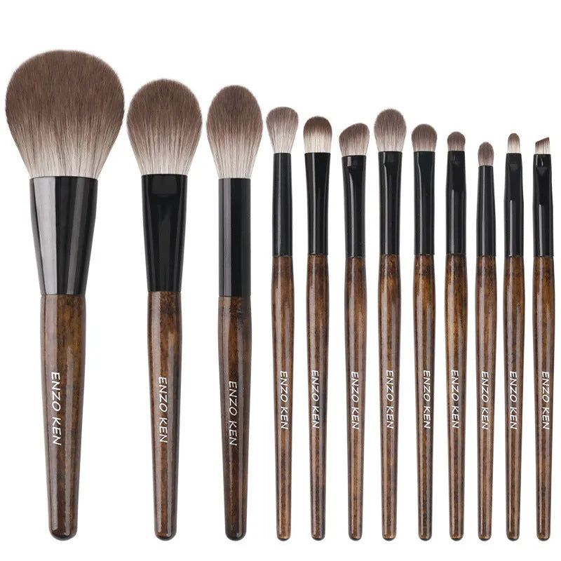 12-piece makeup brush set with wooden handles and a black PU storage pouch.