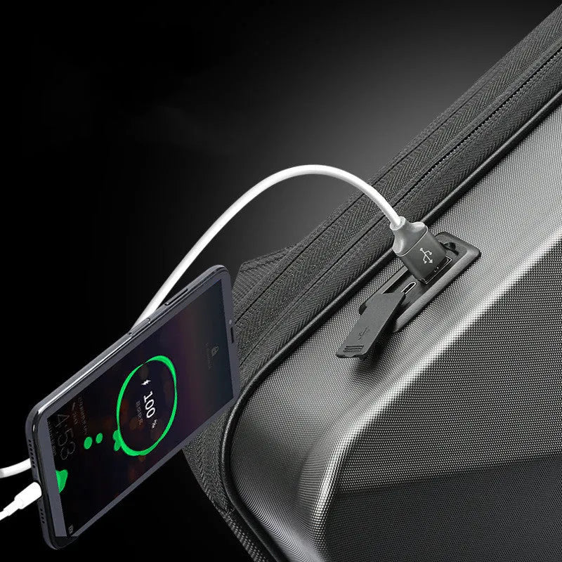 Hard-shell titanium silver gaming backpack with lock, showing internal organiser pockets.
