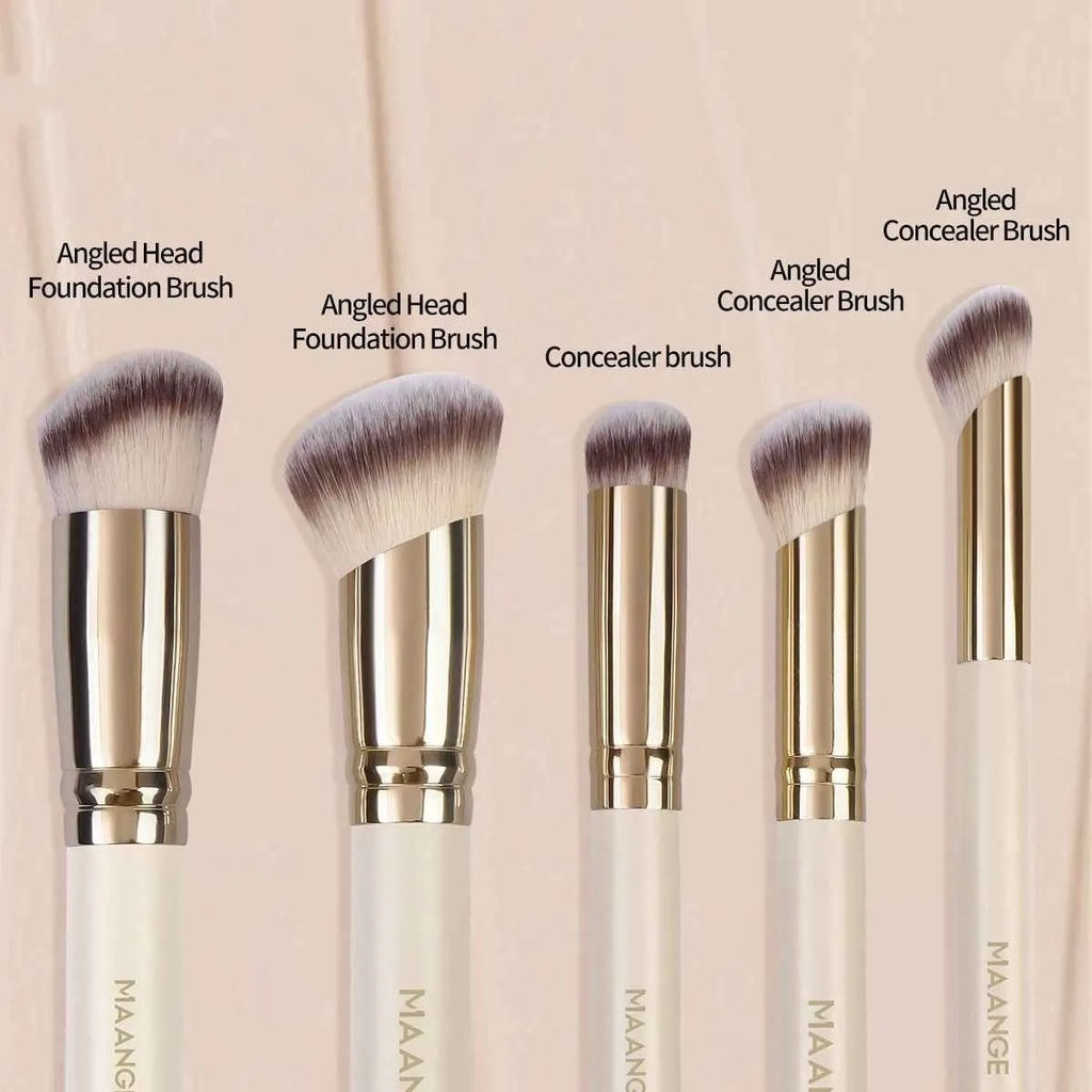 Five apricot-coloured makeup brushes including angled blusher brush for cheek application