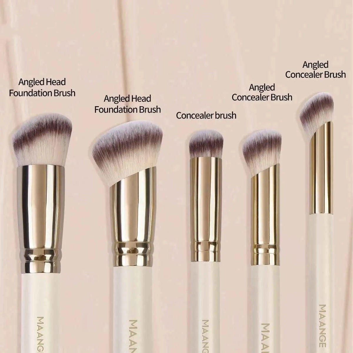 Five apricot-coloured makeup brushes including angled blusher brush for cheek application