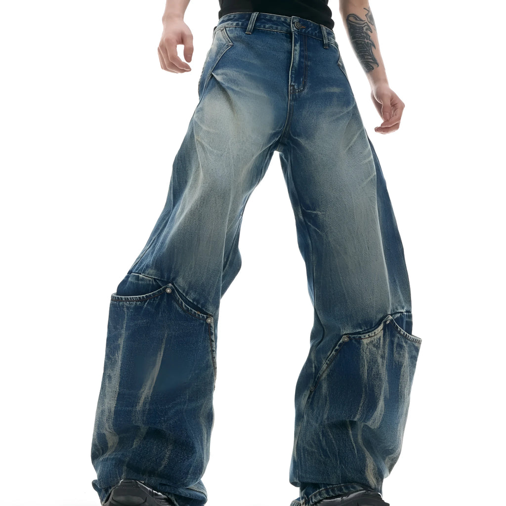 Men's verdant blue loose-fit jeans with a retro washed burst pattern and curved knife design.