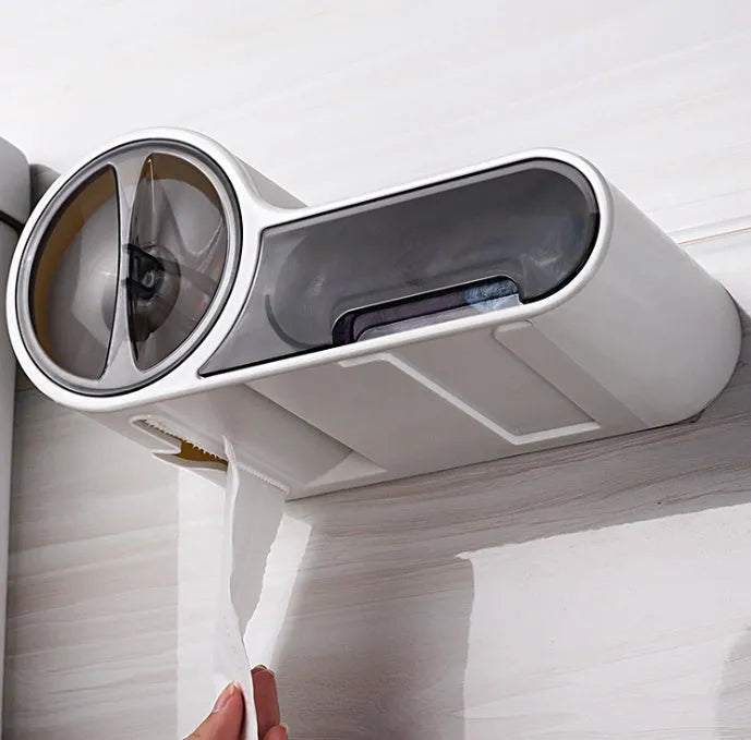 White plastic toilet roll holder with streamline curve design mounted on a bathroom wall.