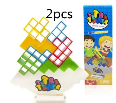 Plastic balance stacking board game with 16 colourful blocks, chassis, and base on a table.